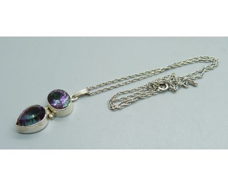 A silver and mystic topaz pendant and chain 
