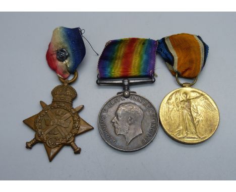 A set of three WWI medals including 1914 Mons Star to 8608 Pte. J. Davies, 1/R, W. Fus with rosette 