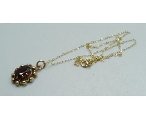 A 9ct gold garnet pendant and fine 9ct gold chain, 2.2g 