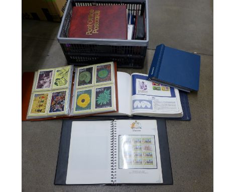 A collection of first day covers and Royal Mail postcards, some loose and in albums **PLEASE NOTE THIS LOT IS NOT ELIGIBLE FO