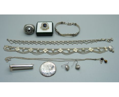 A pair of silver earrings and a brooch, a silver bracelet, a silver posy holder, a tigers eye set necklace, two Eastern white