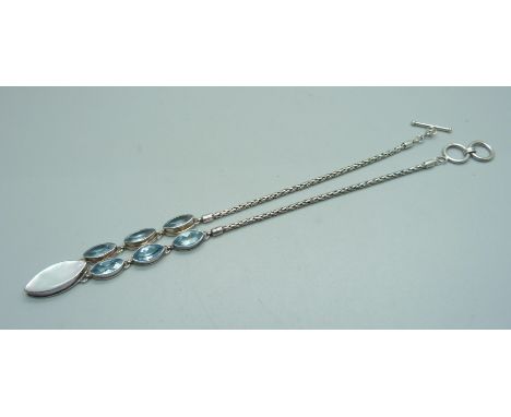 A silver, topaz and mother of pearl necklace 
