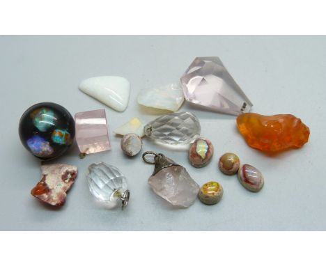 Unmounted and uncut gemstones including opal 