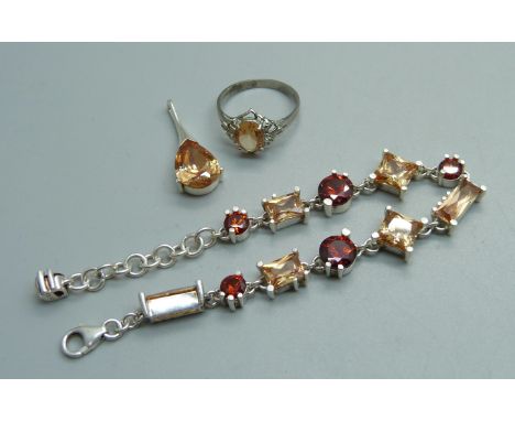 A silver and citrine pendant, bracelet and ring set, ring size Q 