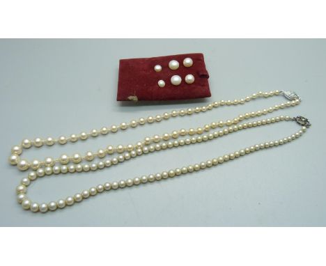 Three pairs of cultured pearl earrings and two silver mounted strings of pearls 