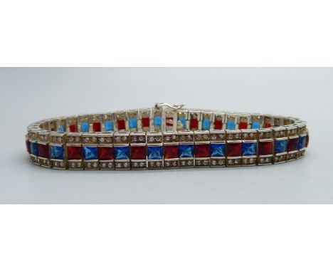 A silver white, red and blue stone bracelet 