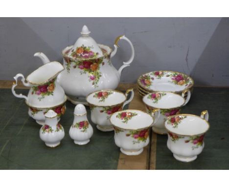 A Royal Albert four setting tea service and a pair of salt and pepper shakers, small chip on the tea pot spout **PLEASE NOTE 