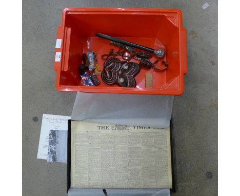 A page turner with 4-head top, silver handled button hook, copper bangle, wooden carvings and a copy of The Times, March 1941
