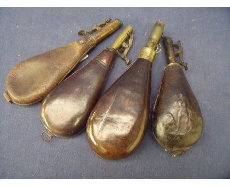 Group of four leather bodied shot flasks, one with embossed detail of stag hunting, with makers mark for G Hawksley Sheffield