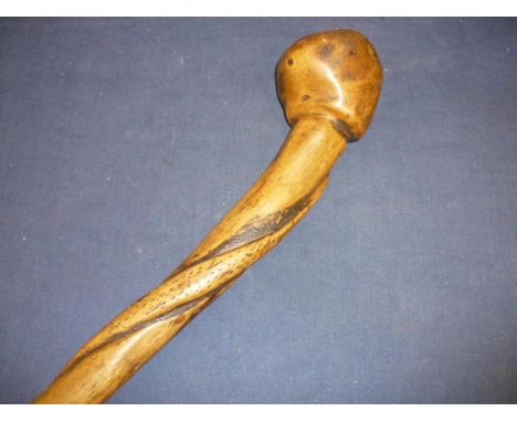 African tribal style Knobkerrie made from a tree root carved with entwined figure of a snake (overall length 82cm) 