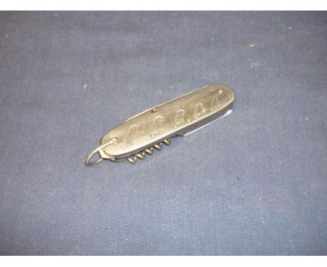 Stainless steel fisherman's knife with lanyard ring, with five foldout attachments including blade, file, scissors, corkscrew