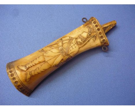 18th C continental carved bone powder flask depicting a figure of an archer, with tassel to the rear, two iron ring mounts an