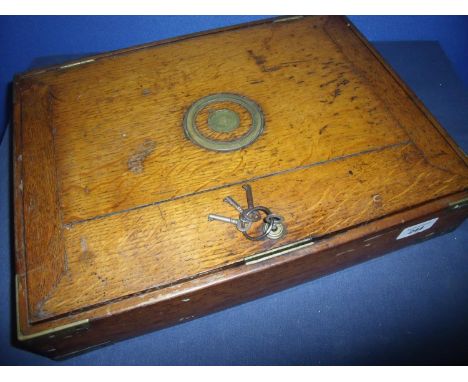 Vintage light oak and brass bound rectangular cartridge type box with various internal dividers and inset circular lift up ha