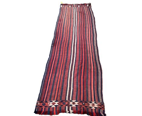 A Kilim style runner, the red and blue stripes and kilim stylized pattern to end of the rug, 109/344cm 