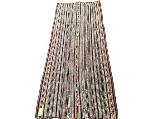 A Kilim style rug/runner with all over stylized reds and greys stripes, 133/310cm 