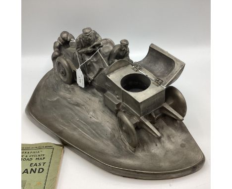 A reproduction cast resin and pewter covered model of the original SPIRIT OF ECTASY as a gents desk tidy with inkwell and pen