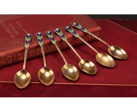 A set of six Art Deco silver-gilt and enamel coffee spoons, Birmingham 1950, cased