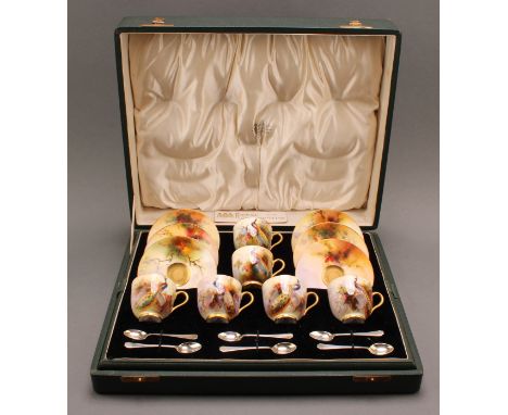 A set of six Royal Worcester coffee cups and saucers, painted by Reginald Austin, signed, with peacock perched in a pine tree