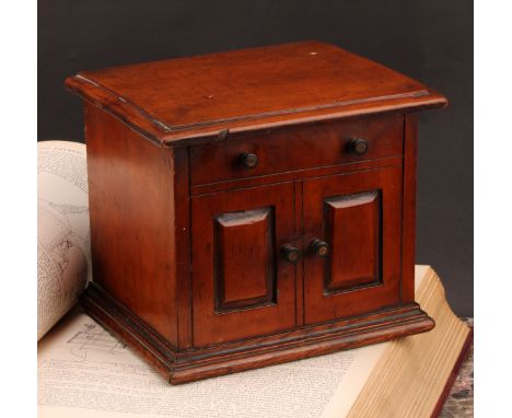 A Victorian walnut novelty tea caddy, as a miniature chest or cabinet, hinged cover enclosing a lidded compartment, above a f