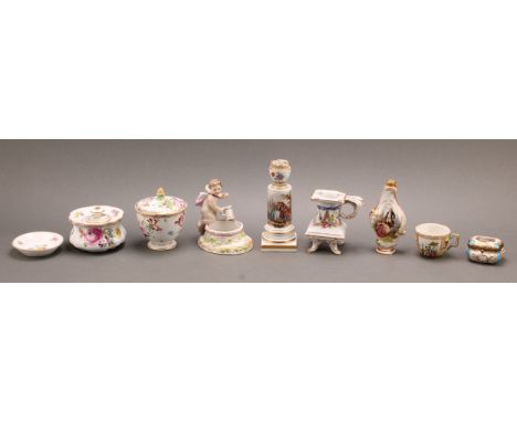 A Meissen porcelain candlestick, modelled as an urn on a columnar pedestal base, the column finely painted with courting coup