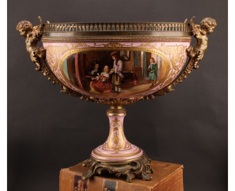 A large Continental gilt bronze mounted porcelain table centre, in the manner of Sèvres, the front panel painted with an inte