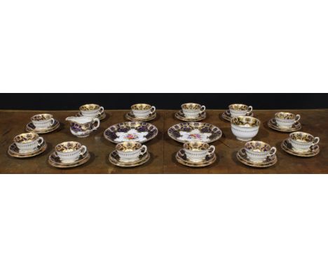 A Royal Worcester composed tea service for twelve, painted by E. Barker, E. Phillips, J. Stanley and W.Hale, signed, with col
