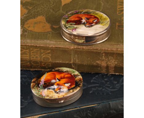 A silver and enamel oval pill box, decorated with a curled up fox, 38mm wide, import marks for Hansford &amp; Ainsworth, Birm