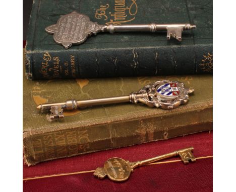 Copoclephily - a George V silver-gilt and enamel presentation key, ...On the Opening of the Torquay Preparatory Grammar Schoo
