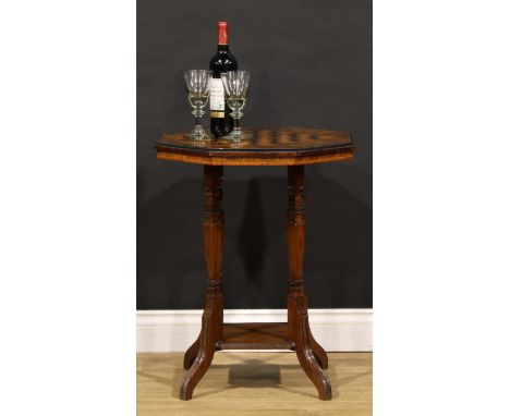 A late Victorian walnut and parquetry games table, octagonal top inlaid for chess, square inverted-baluster supports, open un