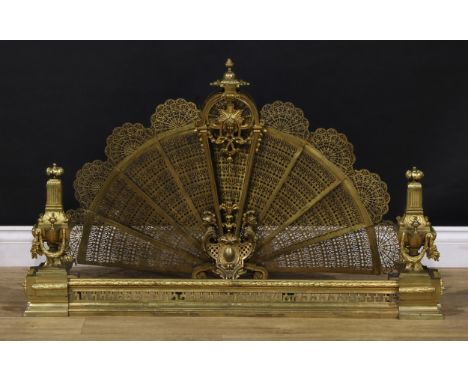 A Louis XVI Revival gilt metal composed hearth suite, comprising fire curb and spark guard fan, the fender 96.5cm extending t
