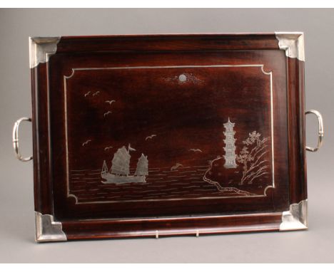 A Chinese silver and hardwood rectangular serving tray, inlaid with a junk and a pagoda, 61.5cm over faux bamboo handles, c.1