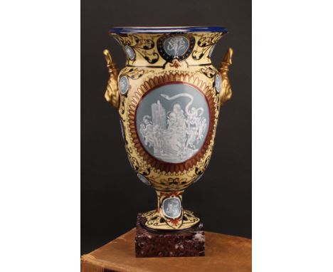 A large Continental pate-sur-pate two handled pedestal vase, decorated with classical scene of a maiden playing pipe organ, a