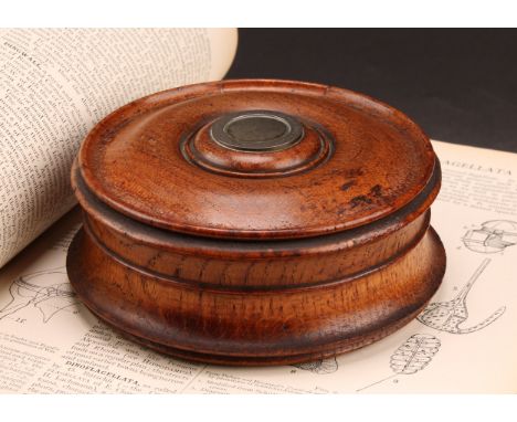 A large early Victorian salvaged oak draught-turned circular table snuff box, the push fitting cover with inset roundel inscr