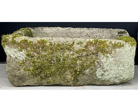 A stone garden trough, 24cm high, 65cm wide, 49cm deep