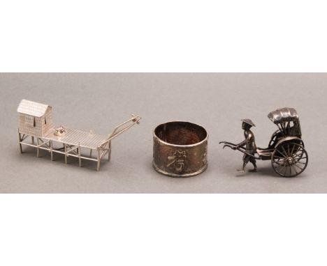 A Chinese silver miniature model, of a waterside building, 7.5cm long, character mark; another, of a rickshaw, 7cm long, Wang
