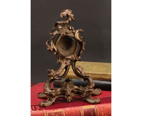 A substantial 19th century gilt bronze pocket watch stand, cast in the Rococo taste with scrolling acanthus, 27cm high, c.186