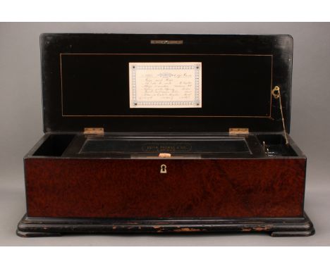 A late 19th century Swiss amboyna and ebonised music box, by Nicole Frères, 34cm cylinder playing six airs on a two-piece com