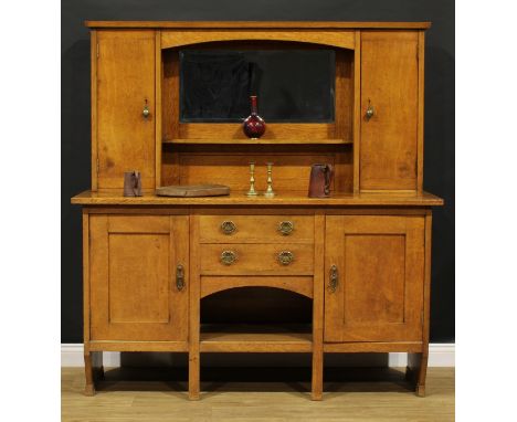 An Arts & Crafts oak dog kennel sideboard, by Christopher Pratt & Sons, Bradford (fl.1850-c.1920), bevelled mirror back above