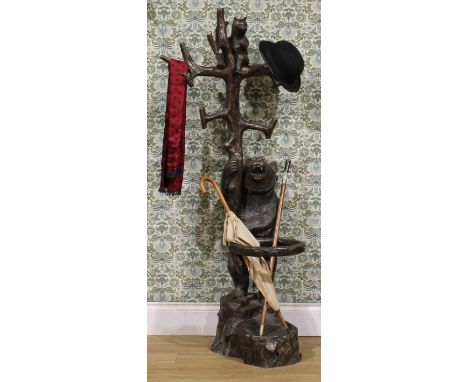 A contemporary bronze country house entrance hall stand, cast in the 19th century Black Forest taste with a bear holding alof
