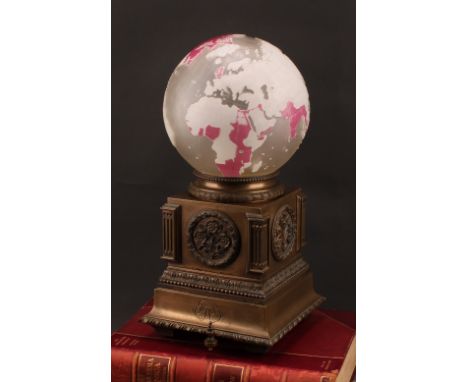 An early 20th century bronze and cameo glass cartographic table lamp, possibly an exhibition piece, the shade as a terrestria
