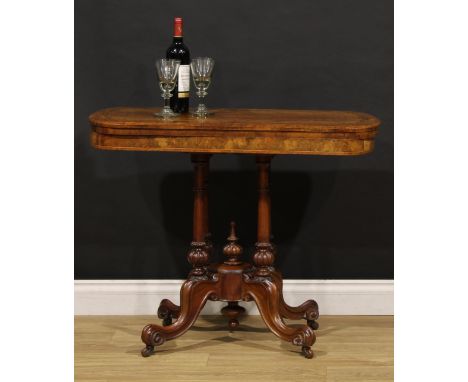 A Victorian walnut and marquetry card table, hinged top enclosing a baize lined playing surface, turned supports, cabriole le