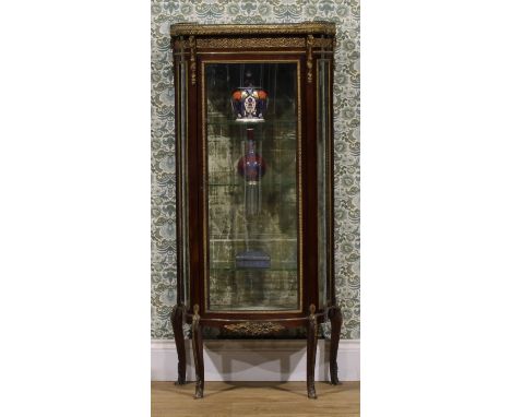 A Louis XV Revival gilt metal mounted mahogany bow-fronted vitrine, by or retailed by James Shoolbred &amp; Co, Tottenham Hou