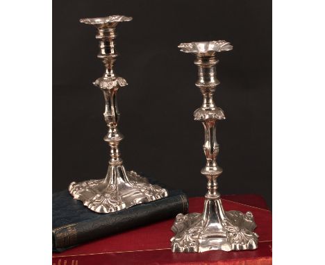 A pair of Russian silver candlesticks, of mid-18th century design, detachable nozzles, knopped pillars, shaped square bases w