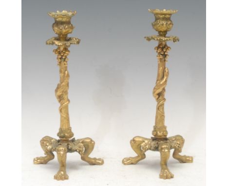 A pair of 19th century French gilt bronze tripod candlesticks, cast with lizards and fruiting vine, lion monopodia, 26.5cm hi