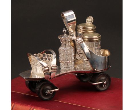 A Victorian E.P.N.S novelty cruet, as a roller skate, turned rosewood wheels, 19cm long, design no. 2082, registration lozeng