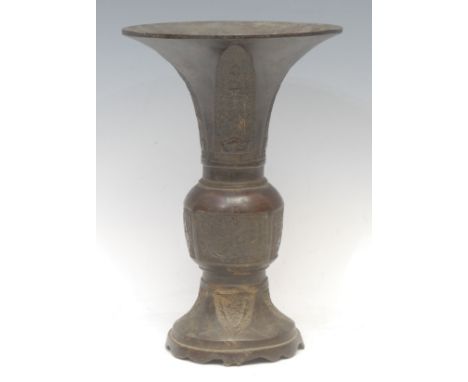A Chinese patinated bronze gu vase, cast in the Archaic taste, 27cm high, Yuan Dynasty character mark and possibly of the per