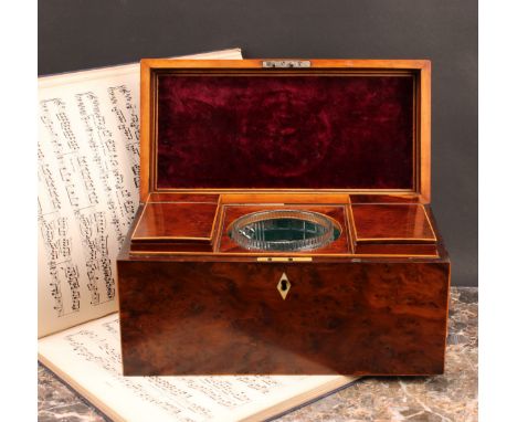 A George III yew rectangular tea caddy, hinged cover with Old Sheffield plate, navette shaped handle, enclosing a bowl and a 