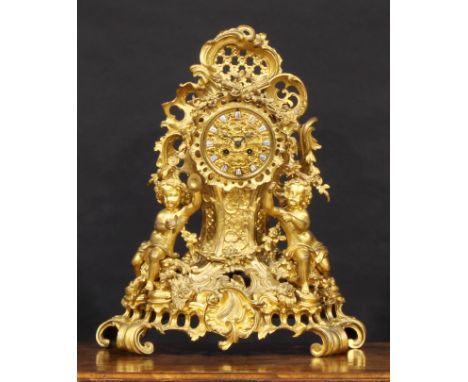 A 19th century French gilt bronze mantel clock, 10cm dial applied with Roman numerals, twin winding holes, eight day movement