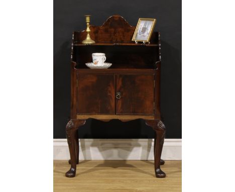 A George II mahogany bedroom night cabinet, shaped superstructure with open shelf, above a pair of doors, cabriole legs, pad 