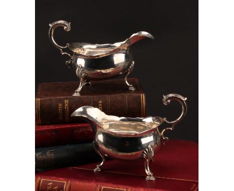 A pair of early George III silver sauce boats, acanthus-capped flying scroll handles, hoof feet with shells to knees, 17cm lo